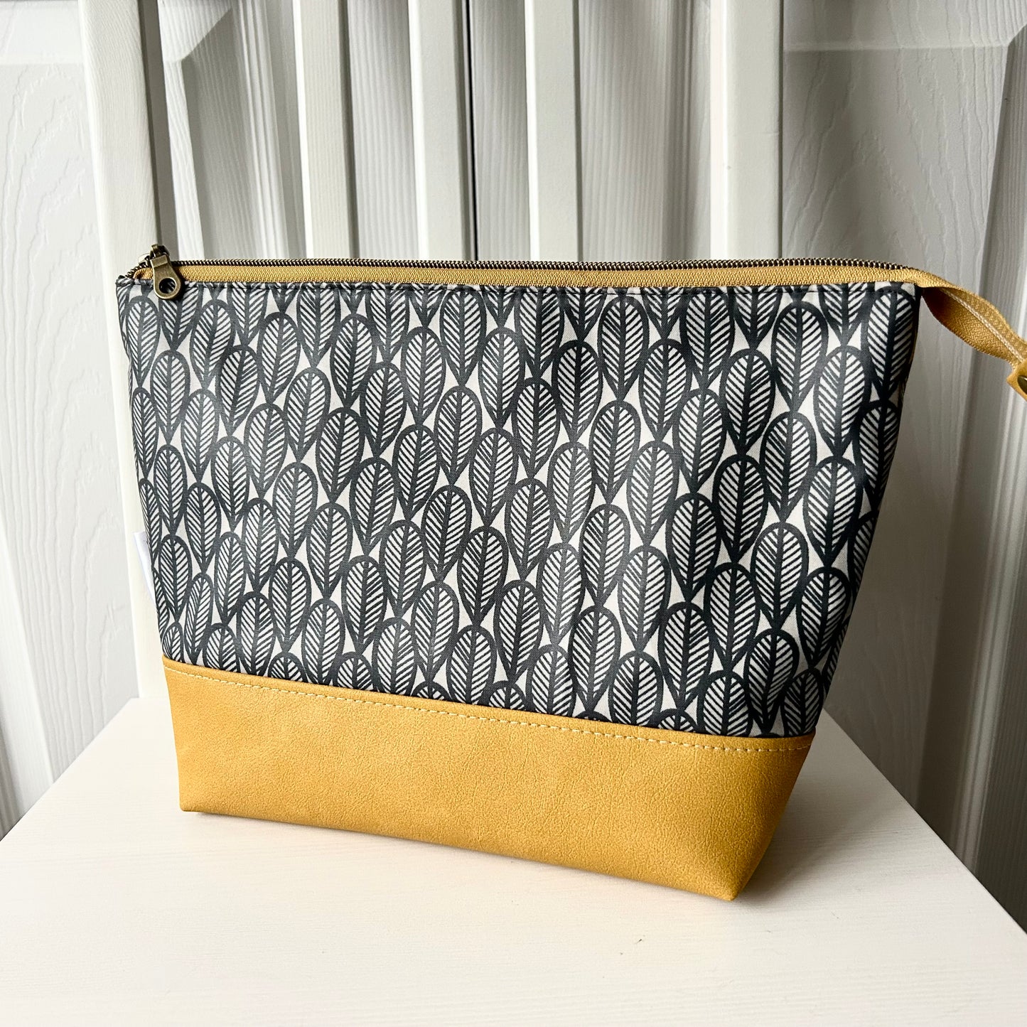 Grey leaves with mustard jumbo waterproof toiletry bag